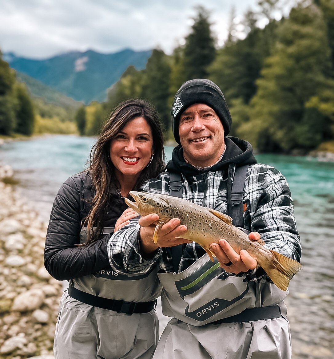 Couple fly fishing bariloche for brown trout on the Manso River in Bariloche Argentina